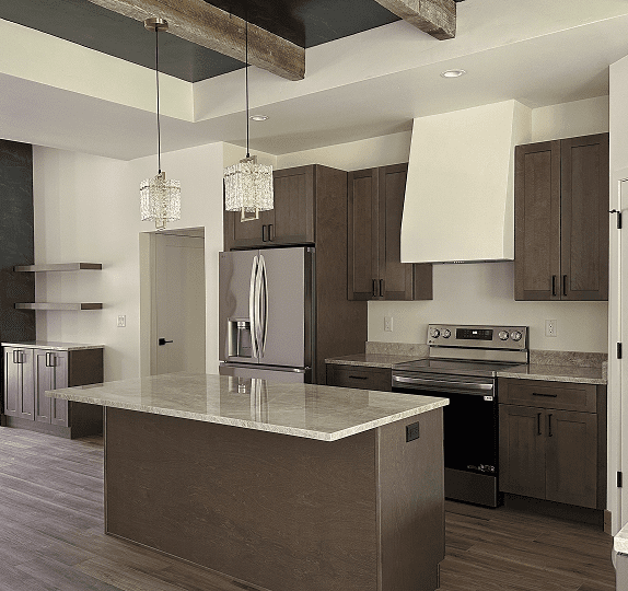 Modern kitchen with island, stainless steel appliances, and wooden cabinetry.